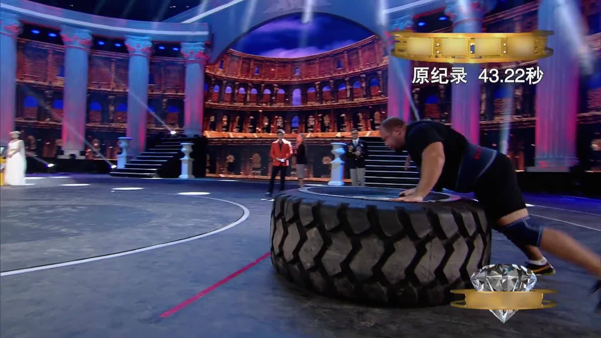 Cape-Wearing Gladiators Flip Massive Tire